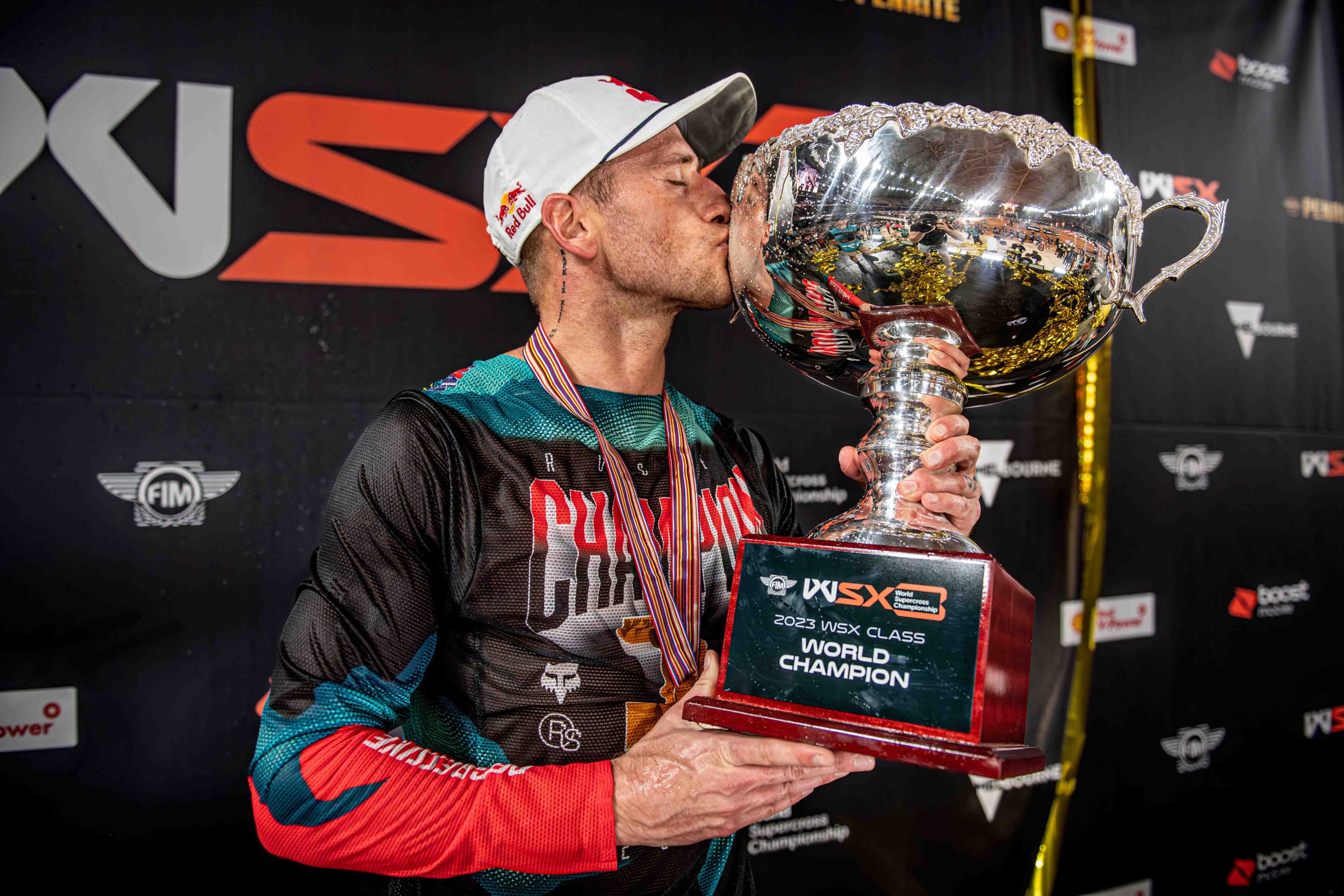 Ken Roczen kissing a WSX trophy